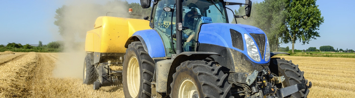 Tracor driving in wheat field
